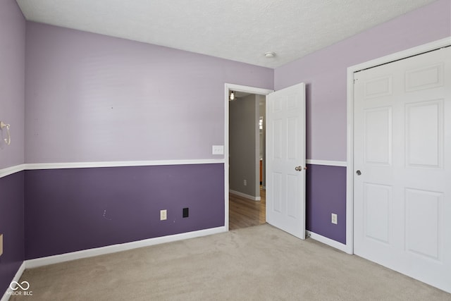 10693 Newgate Ln, Indianapolis, IN 46231 - unfurnished bedroom with carpet, baseboards, and a textured ceiling