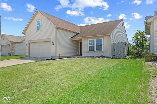 10693 Newgate Ln, Indianapolis, IN 46231 - traditional home with driveway, an attached garage, and roof with shingles