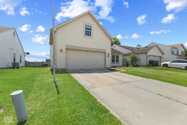 10693 Newgate Ln, Indianapolis, IN 46231 - traditional-style house featuring an attached garage, concrete driveway, and cooling unit