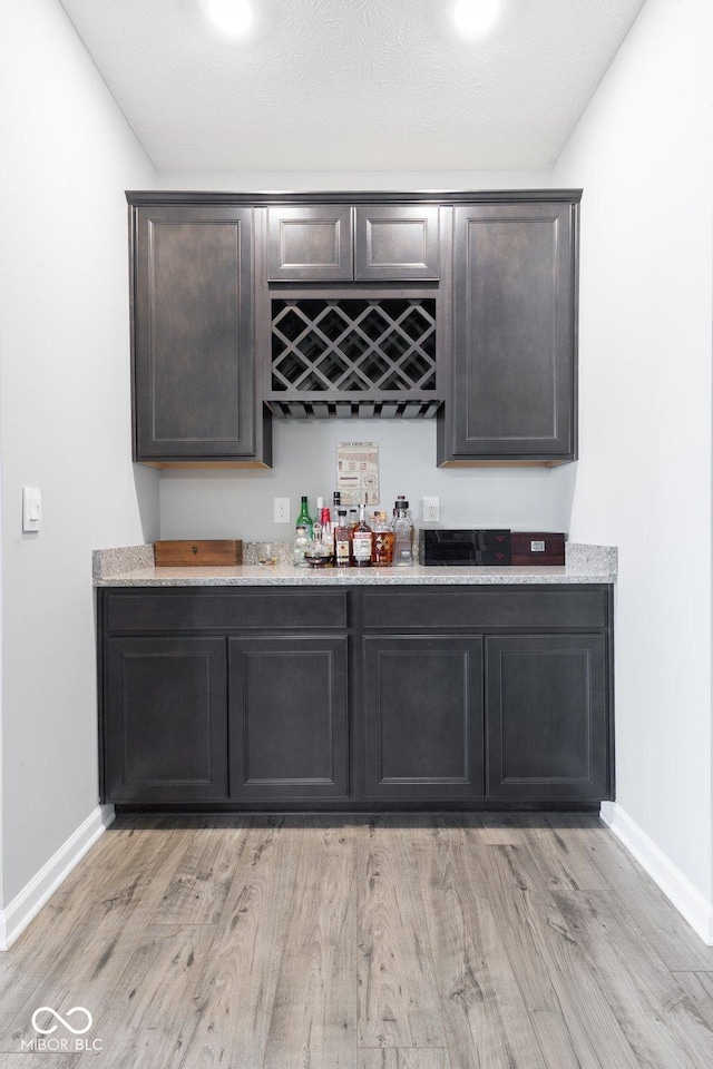 7834 Fairwood Blvd, Plainfield, IN 46168 - indoor dry bar with light wood finished floors and baseboards