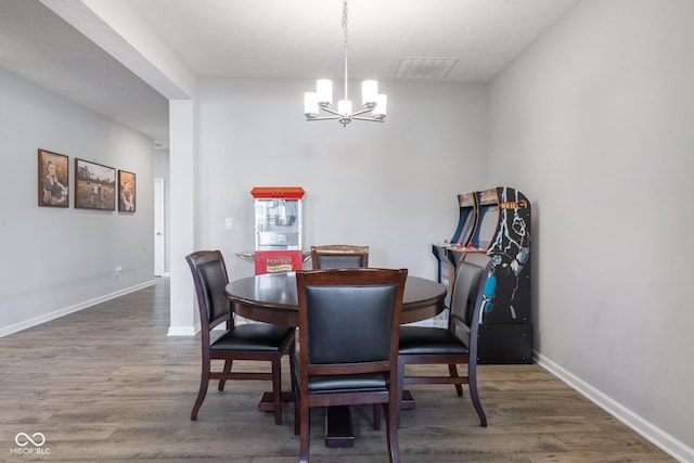 7834 Fairwood Blvd, Plainfield, IN 46168 - dining space with a chandelier, wood finished floors, and baseboards