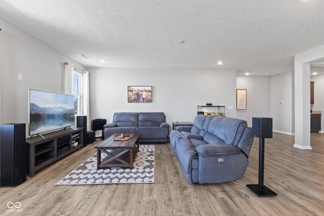 7834 Fairwood Blvd, Plainfield, IN 46168 - living area with wood finished floors, a textured ceiling, baseboards, and recessed lighting