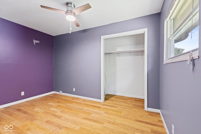 3898 S Randolph St, Indianapolis, IN 46227 - unfurnished bedroom featuring a closet, light wood-type flooring, and ceiling fan