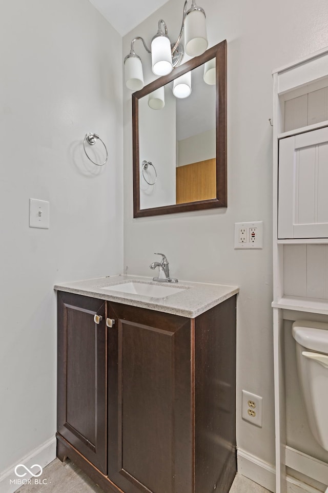 3898 S Randolph St, Indianapolis, IN 46227 - bathroom featuring baseboards and vanity
