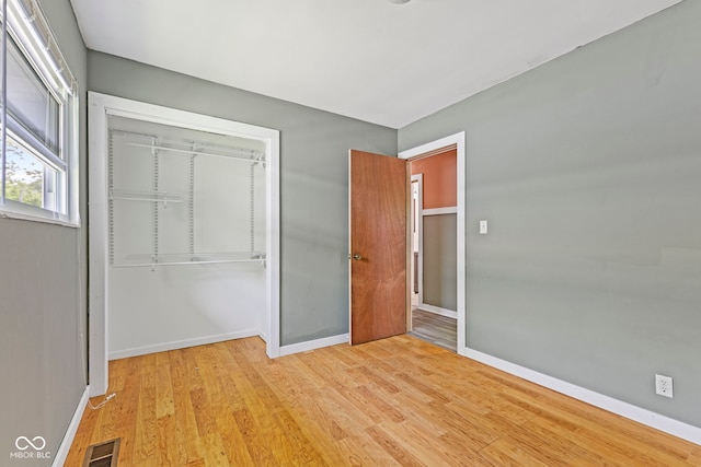 3898 S Randolph St, Indianapolis, IN 46227 - unfurnished bedroom with a closet and wood finished floors
