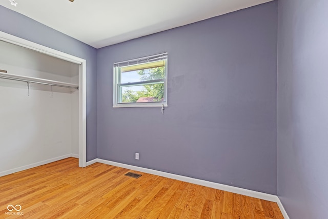 3898 S Randolph St, Indianapolis, IN 46227 - unfurnished bedroom with light wood-type flooring and a closet