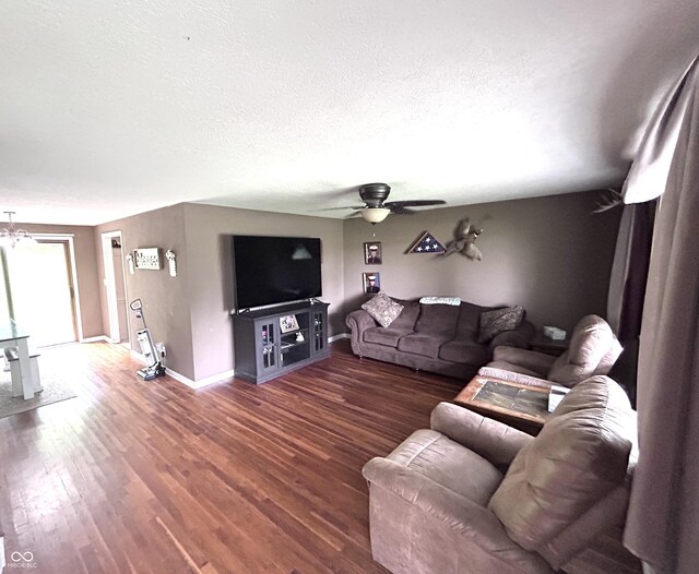 5174 S Greensboro Pike, Knightstown, IN 46148 - living area featuring ceiling fan, wood finished floors, baseboards, and a textured ceiling
