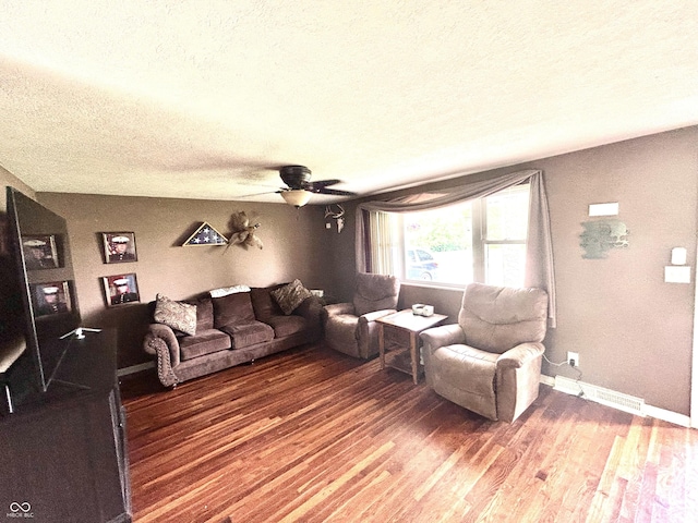 5174 S Greensboro Pike, Knightstown, IN 46148 - living area featuring a textured ceiling, wood finished floors, ceiling fan, and baseboards