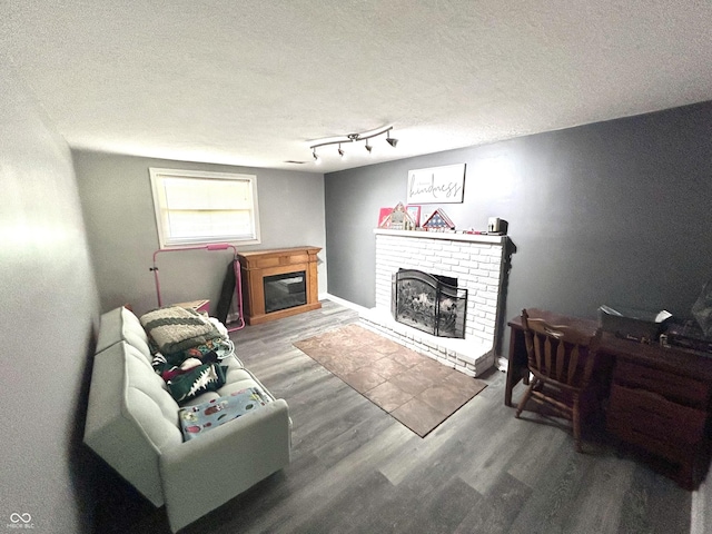 5174 S Greensboro Pike, Knightstown, IN 46148 - living area with a fireplace, wood finished floors, and a textured ceiling