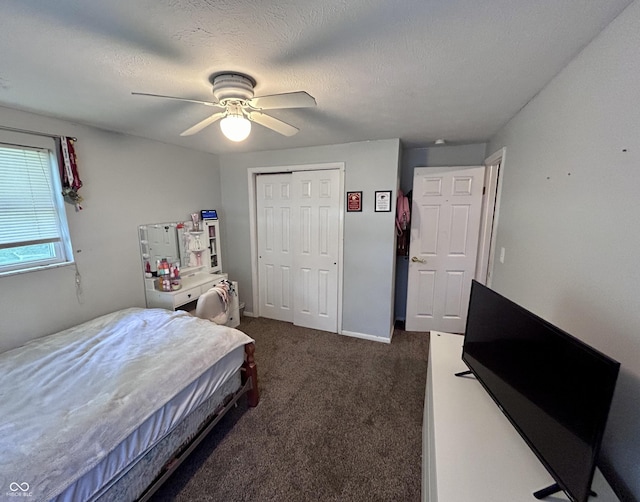 5174 S Greensboro Pike, Knightstown, IN 46148 - bedroom with dark colored carpet, a closet, and a ceiling fan
