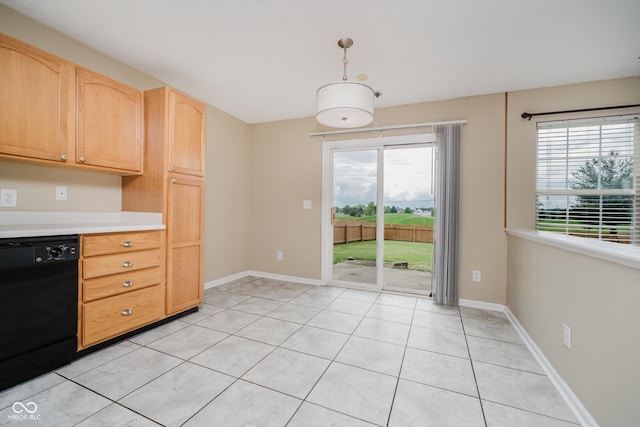 5258 Brassie Dr, Indianapolis, IN 46235 - kitchen with black dishwasher, light countertops, light tile patterned floors, light brown cabinetry, and hanging light fixtures