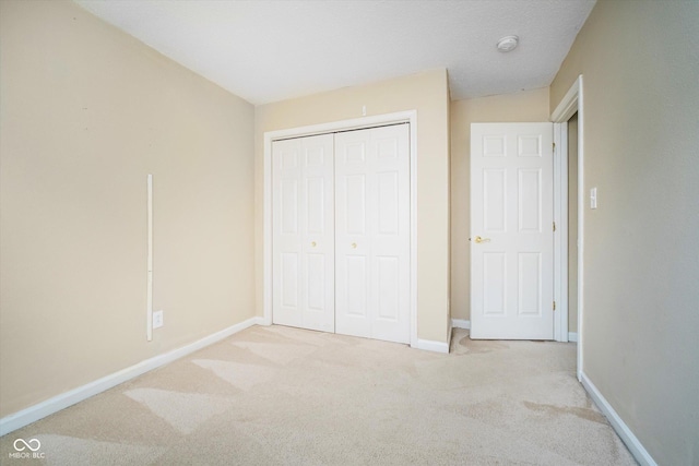 5258 Brassie Dr, Indianapolis, IN 46235 - unfurnished bedroom with carpet flooring, a closet, and baseboards