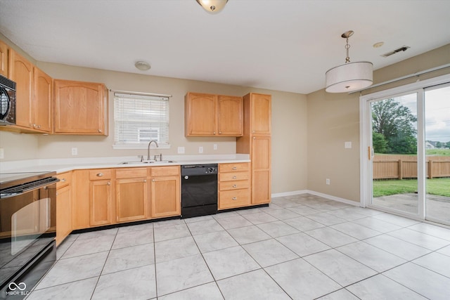 5258 Brassie Dr, Indianapolis, IN 46235 - kitchen featuring a sink, black appliances, healthy amount of natural light, and light countertops