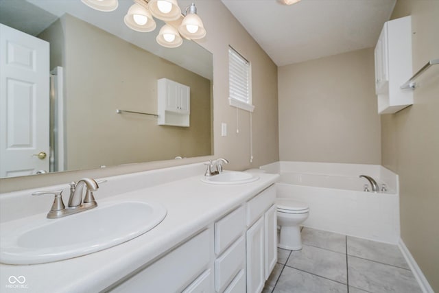 5258 Brassie Dr, Indianapolis, IN 46235 - full bath featuring a garden tub, toilet, double vanity, and tile patterned flooring