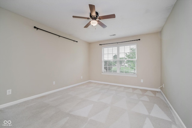 5258 Brassie Dr, Indianapolis, IN 46235 - spare room featuring light carpet, baseboards, and ceiling fan