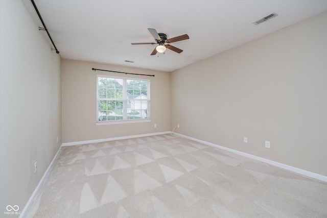 5258 Brassie Dr, Indianapolis, IN 46235 - empty room with light colored carpet, a ceiling fan, and baseboards