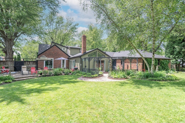 5315 Camden St, Indianapolis, IN 46227 - view of front of home featuring brick siding, a chimney, and a wooden deck