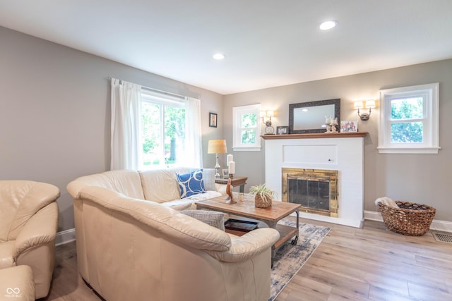 5315 Camden St, Indianapolis, IN 46227 - living room featuring light wood-type flooring, a fireplace, recessed lighting, and baseboards