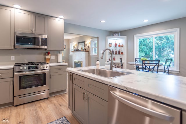 5315 Camden St, Indianapolis, IN 46227 - kitchen featuring stainless steel appliances, a sink, gray cabinets, light wood finished floors, and recessed lighting