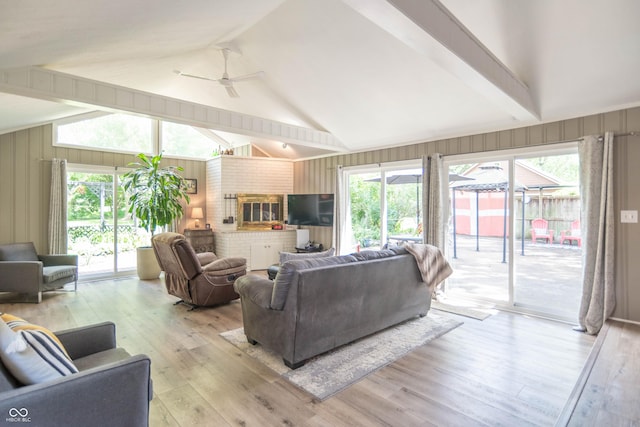 5315 Camden St, Indianapolis, IN 46227 - living area with light wood-type flooring, plenty of natural light, ceiling fan, and wooden walls