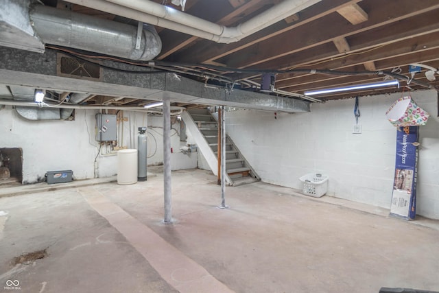 5315 Camden St, Indianapolis, IN 46227 - unfinished basement with stairway, water heater, and a water softener