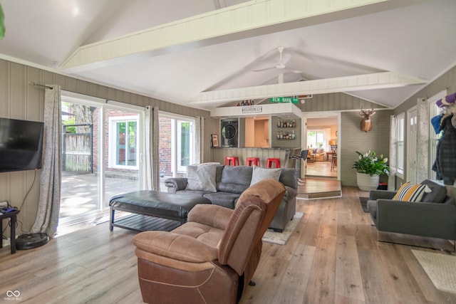 5315 Camden St, Indianapolis, IN 46227 - living area featuring estacked washer and dryer, light wood-style flooring, and a ceiling fan