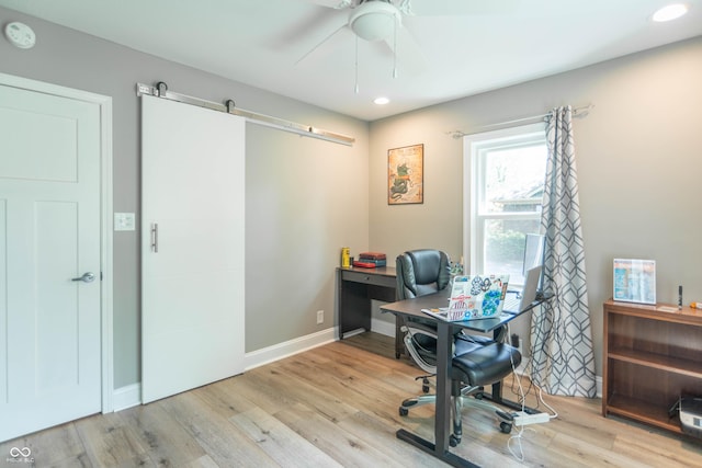 5315 Camden St, Indianapolis, IN 46227 - office area featuring a barn door, wood finished floors, recessed lighting, ceiling fan, and baseboards