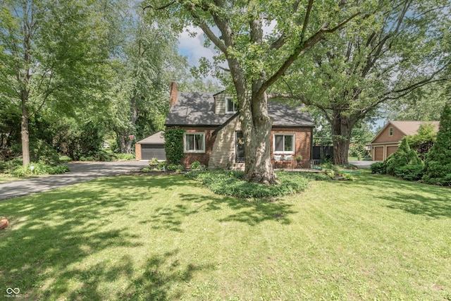 5315 Camden St, Indianapolis, IN 46227 - view of front of property featuring brick siding, a front yard, and a garage