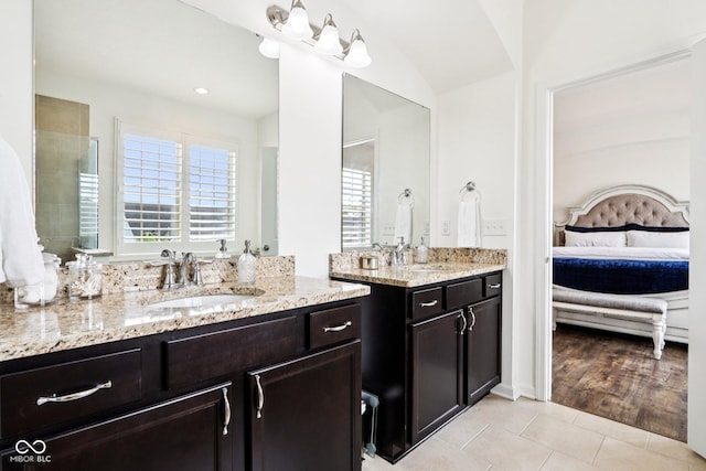 1521 Avondale Dr, Westfield, IN 46074 - full bath featuring ensuite bath, tile patterned flooring, two vanities, and vaulted ceiling