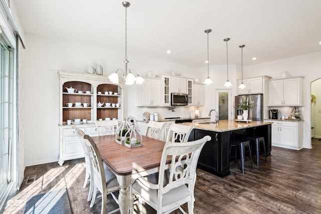 1521 Avondale Dr, Westfield, IN 46074 - dining space featuring dark wood-style flooring, recessed lighting, a chandelier, and baseboards