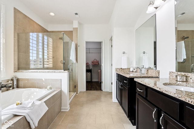 1521 Avondale Dr, Westfield, IN 46074 - bathroom with a shower stall, vanity, a garden tub, a walk in closet, and tile patterned floors