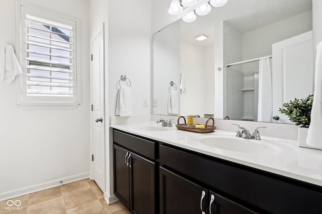 1521 Avondale Dr, Westfield, IN 46074 - full bathroom with double vanity, baseboards, and a shower