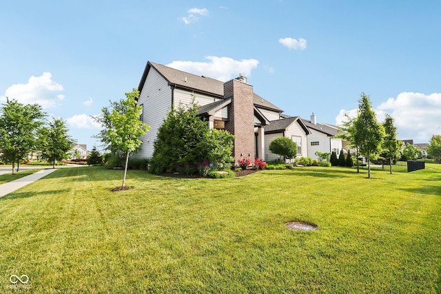 1521 Avondale Dr, Westfield, IN 46074 - view of property exterior featuring a yard and a chimney