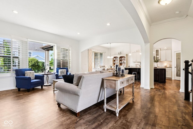1521 Avondale Dr, Westfield, IN 46074 - living area featuring arched walkways, healthy amount of natural light, dark wood-style flooring, crown molding, and recessed lighting