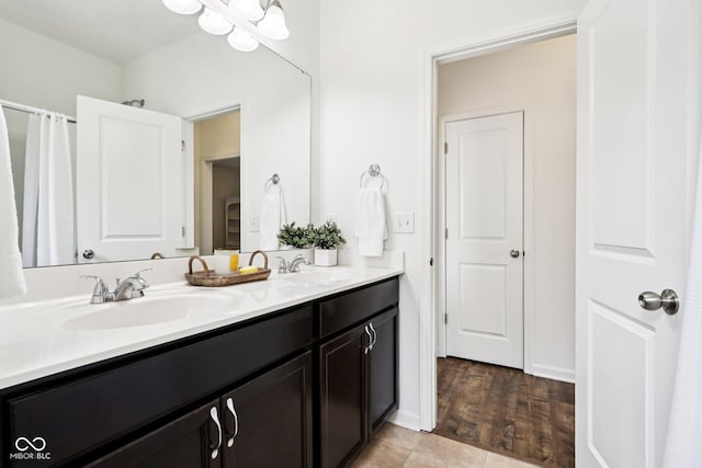 1521 Avondale Dr, Westfield, IN 46074 - bathroom with double vanity and wood finished floors