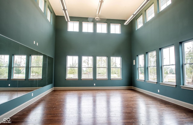 1521 Avondale Dr, Westfield, IN 46074 - spare room with a high ceiling, dark wood-style flooring, and baseboards