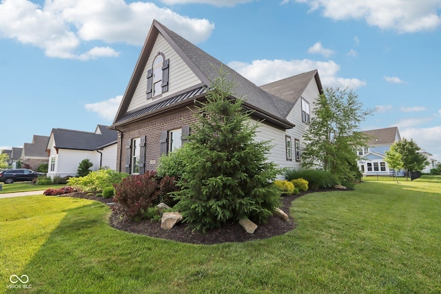 1521 Avondale Dr, Westfield, IN 46074 - view of side of home with a lawn, brick siding, and roof with shingles