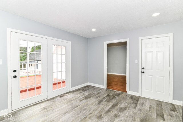 8445 Montery Rd, Indianapolis, IN 46226 - entryway with wood finished floors, baseboards, and recessed lighting