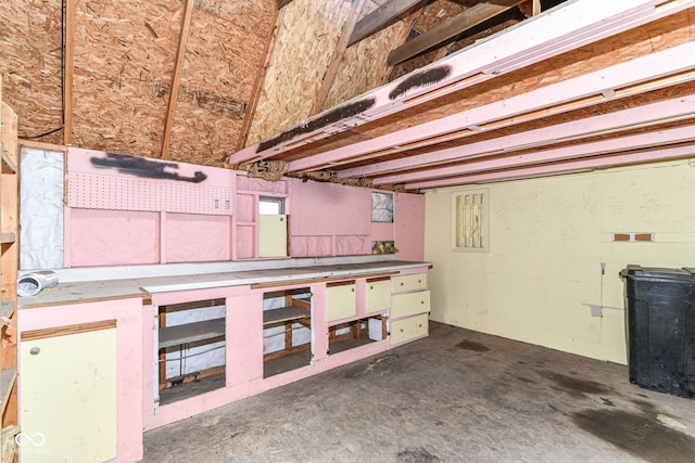 8445 Montery Rd, Indianapolis, IN 46226 - miscellaneous room with a workshop area and unfinished concrete floors