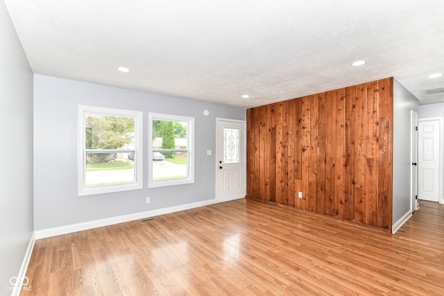 8445 Montery Rd, Indianapolis, IN 46226 - unfurnished living room featuring light wood-style floors, recessed lighting, and baseboards