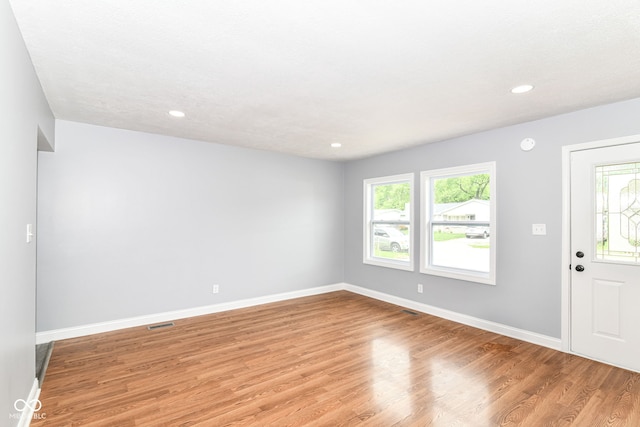 8445 Montery Rd, Indianapolis, IN 46226 - foyer with light wood-style flooring, healthy amount of natural light, baseboards, and recessed lighting