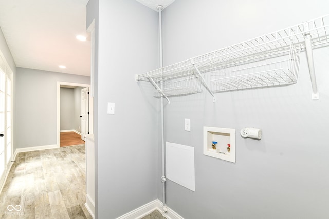 8445 Montery Rd, Indianapolis, IN 46226 - laundry room with washer hookup, light wood-style floors, baseboards, and recessed lighting
