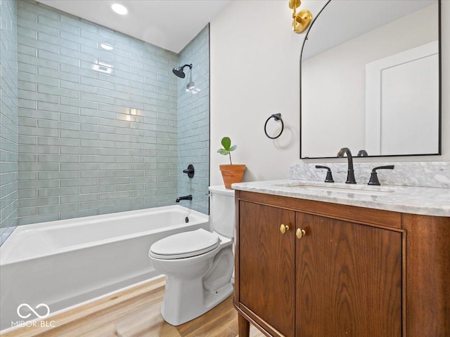 31 Mckenzie St, Shelbyville, IN 46176 - full bath with toilet, wood finished floors, vanity, and shower / washtub combination