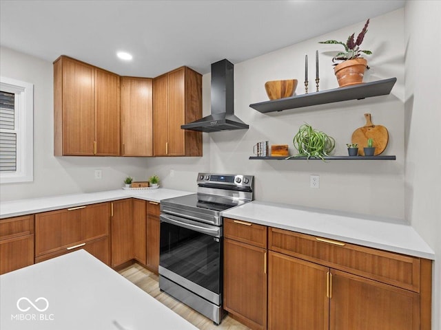 31 Mckenzie St, Shelbyville, IN 46176 - kitchen featuring wall chimney exhaust hood, electric range, light countertops, brown cabinets, and recessed lighting