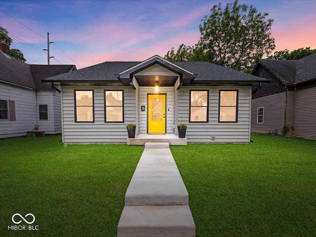 31 Mckenzie St, Shelbyville, IN 46176 - view of front of house featuring a lawn and a shingled roof