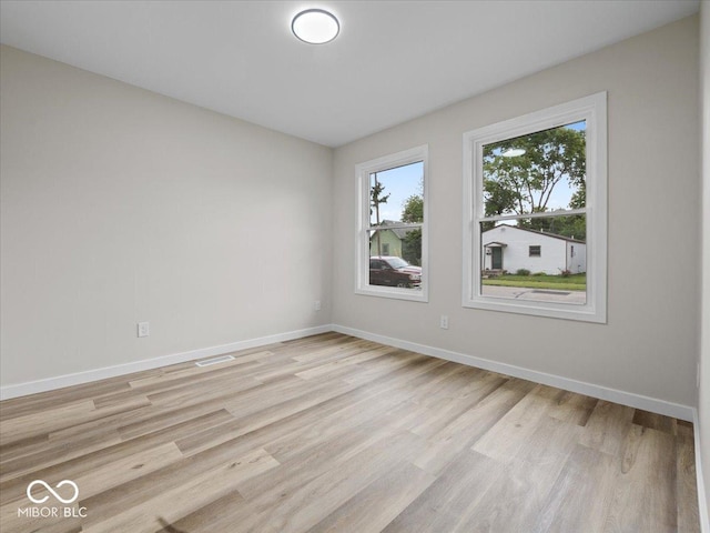 31 Mckenzie St, Shelbyville, IN 46176 - spare room with light wood-type flooring and baseboards