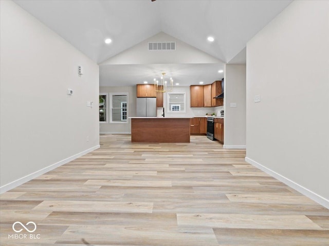 31 Mckenzie St, Shelbyville, IN 46176 - unfurnished living room featuring light wood-type flooring, recessed lighting, baseboards, lofted ceiling, and a sink