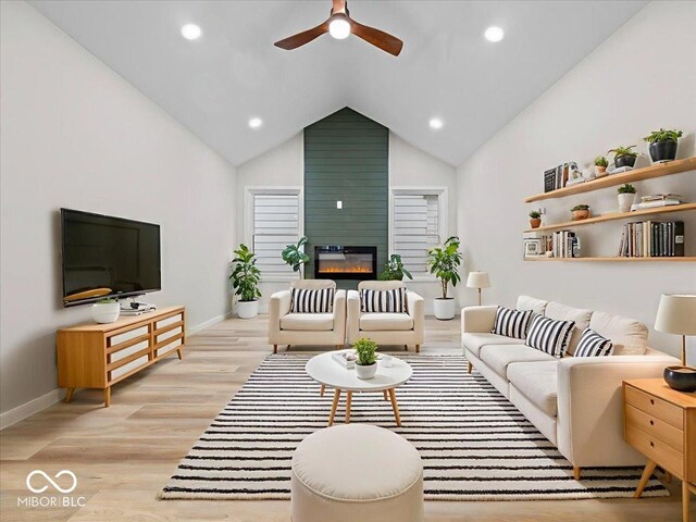31 Mckenzie St, Shelbyville, IN 46176 - living room featuring ceiling fan, light wood-type flooring, a large fireplace, baseboards, and recessed lighting