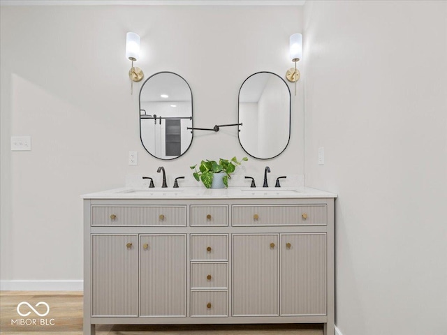 31 Mckenzie St, Shelbyville, IN 46176 - full bath with double vanity, baseboards, and wood finished floors