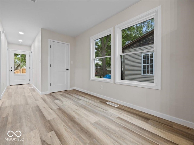 31 Mckenzie St, Shelbyville, IN 46176 - empty room with baseboards, plenty of natural light, light wood-type flooring, and recessed lighting